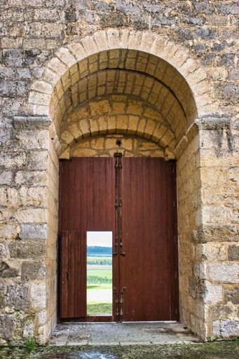 The wooden gate and stone arch of the 13th-century medieval castle of Montealegre de Campos