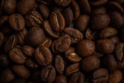 A closeup top view shot of dark roasted coffee beans