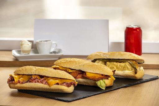 The several types of sandwiches with soda and coffee