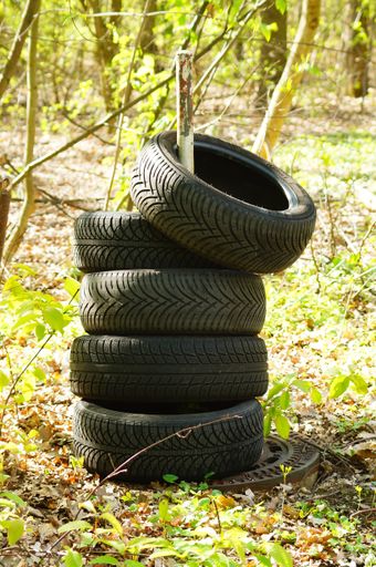 Illegal disposal of used tyres in a park in Frankfurt. Littering is a big problem in big cities.