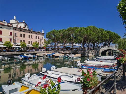 the boats on the water of Lake Garda in Italy look gorgeous