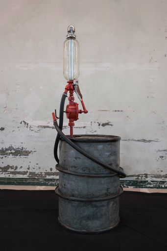 old gasoline barrel with a manual mechanical pump by crank