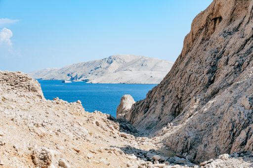 View of beautiful rocky coastline and sea on Pag island in Croatia. Popular tourist destination with amazing rock formations and beautiful coast.