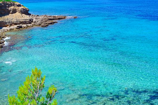 The crystal clear blue water cove in Mallorca, the Balearic Islands, Spain