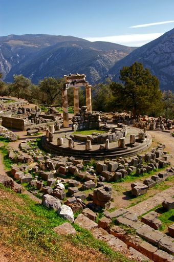 A vertical shot of an ancient monument in Delphi, Greece