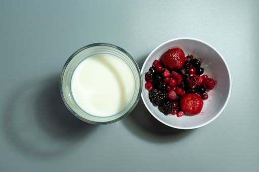 Cup of fruits and milk to prepare a smoothie. Healthy diet concept
