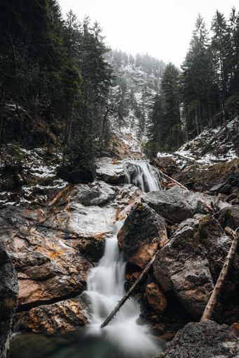 A beautiful scenery of a powerful waterfall flowing through rocky cliffs in Germany
