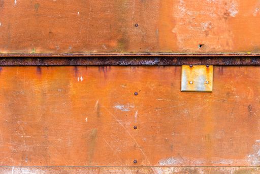 A closeup shot of an old rusted metal background