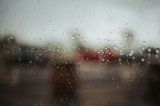 A closeup shot of waterdrops on a glass