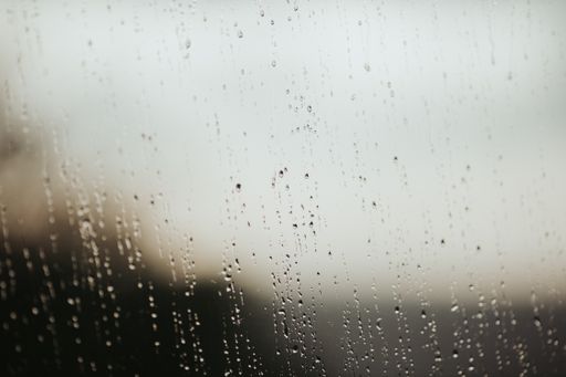 A closeup shot of waterdrops on a glass