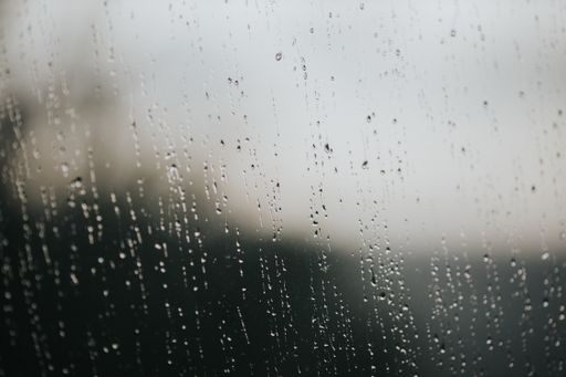 A closeup shot of water droplets on the glass