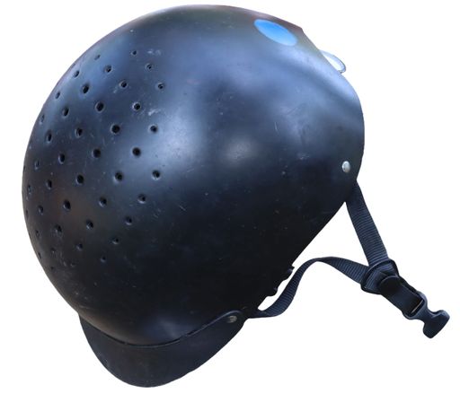A close-up of a riding helmet with a white background