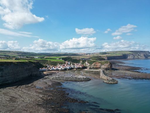 An aerial view of residential houses in coastline of Staithes, North Yorkshire, UK