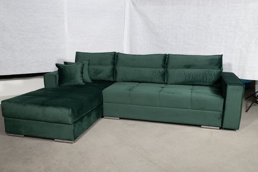 A closeup shot  of a green sofa in a white simple living room