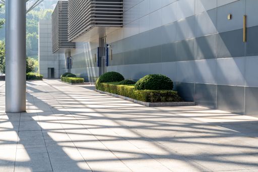 empty concrete floor in front of modern buildings in the downtown street.parking lot for car.