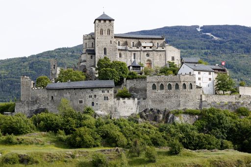 An aerial view of Basilique de Valere in Sion, Switzerland, with a stunning landscape in the background