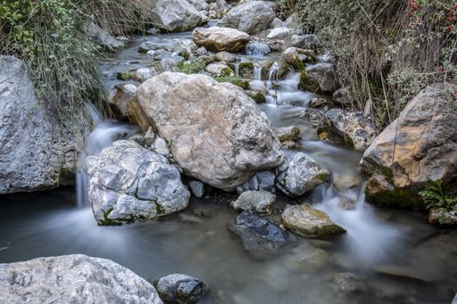 The beautiful scenery of water flowing over rocks with long exposure