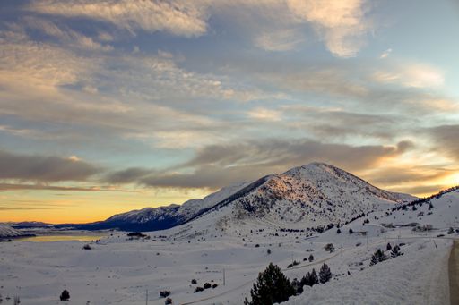 A mesmerizing view of the snow-covered mountains during sunrise in Bosnia and Herzegovina