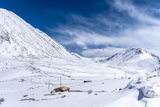 A beautiful landscape of mountain range in Ladakh covered in snow, a great place for snow and winter sports.