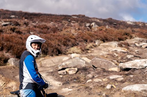 A portrait of a young cyclist with helmet in the mountains in Ticknock forest, Dublin, Ireland