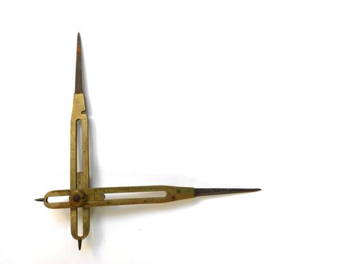 Brass reduction compass or proportional scale divider. Geometry tool used to scale up or down designs and in navigation to transfer distance on charts