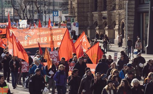 Anti war and anti military protest in Germany. German banners translate into pro peace statements. Thousands of people in the streets