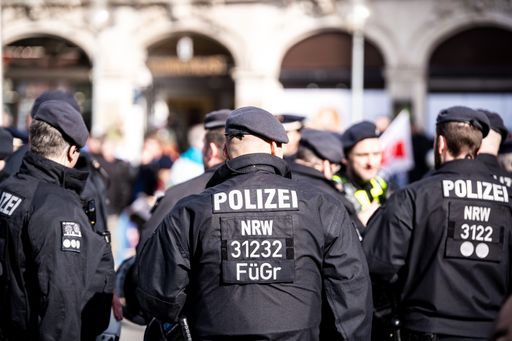 Police officer at demonstration in Germany. Police force keep public demonstration safe. Danger of violence