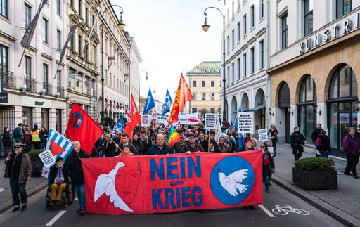Anti war and anti military protest in Germany. German banners translate into pro peace statements. Thousands of people in the streets