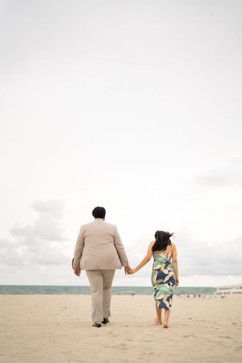 A closeup of a loving couple embracing on a beach, enjoying a romantic moment together