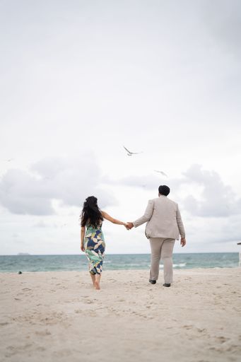 A closeup of a loving couple embracing on a beach, enjoying a romantic moment together