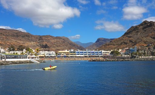 General view of the beach at Playa de Mogan, Gran Canaria, Spain, seen from the sea at a short distance.