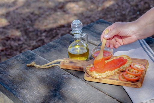 An acorn-fed typical Spanish toast of bread with tomato, olive oil and ham for picnic