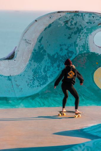 An active young man performing a skateboarding trick on a ramp in Morocco