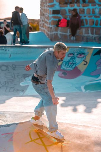 A closeup of a  young man on a skateboard  performing a trick on a ramp in Morocco