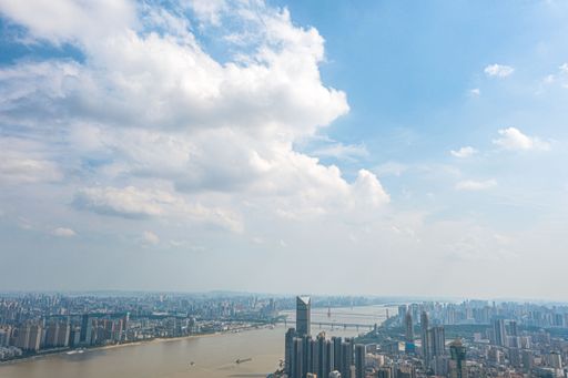 A scene of large, white and gray rainstorm clouds above Wuhan, China