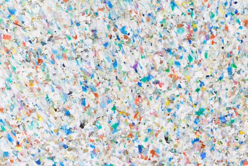 colourful texture of a board made of conglomerated plastic waste pellets via sintering technique