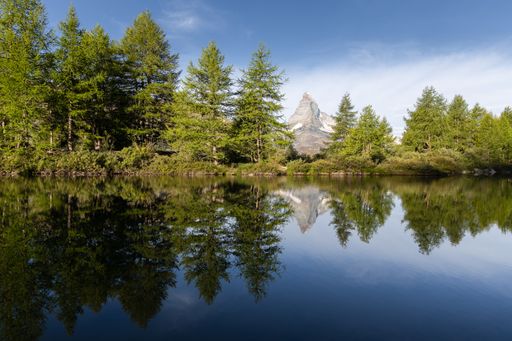 Landscape summer view of the Matterhorn reflecting in the Grindjisee lake in Zermatt