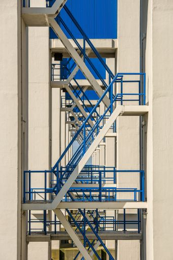Several sets of stairs of a building next to each other