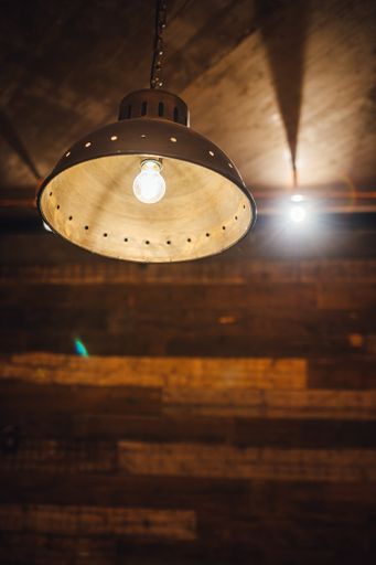 A shot of large vintage lamp hanging from ceiling, modern interior