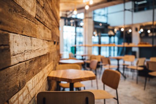 A shot of wooden wall and coffee shop in blurred background