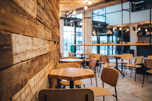 A shot of wooden wall and coffee shop in blurred background