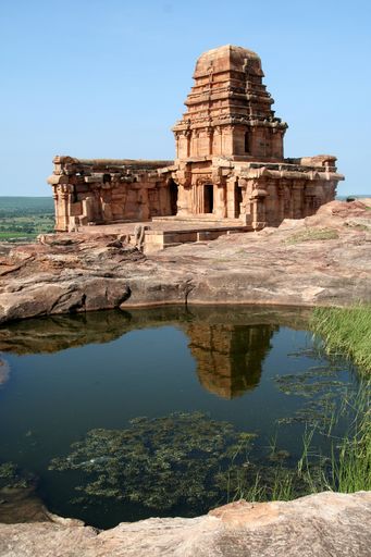 The Upper Shivalaya on a top of northern hill and its reflection in the water, Badami, Karnataka, India