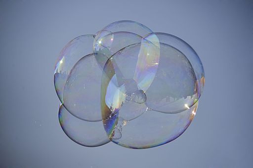 The soap bubbles floating in a blue sky