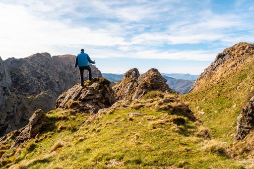 A hiker at the top of the mountain of Aiako Harriak in the town of Oiartzun, Guipuzcoa, Basque Country