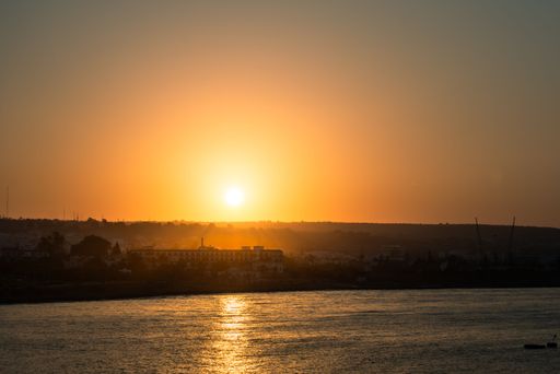 A breathtaking view of the sunrise over the shimmering sea in the beautiful resort town of Ayia Napa, Cyprus
