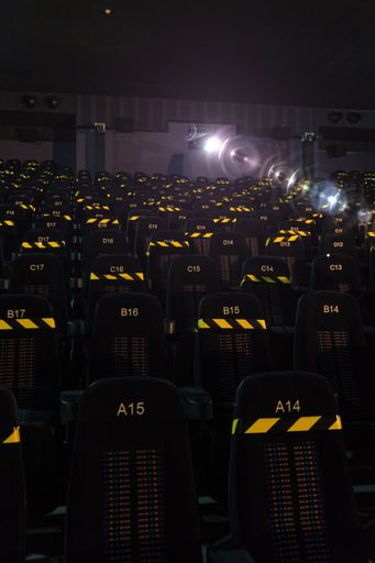 The black marked seats of the cinema auditorium