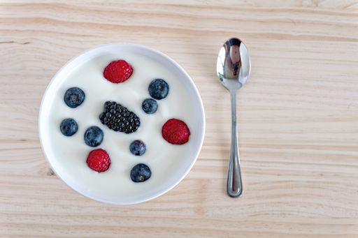 A top view of delicious yogurt with berries for breakfast