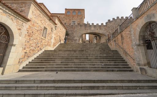 Arch of the Star in the medieval city of Caceres. Stone stairs. Medieval stairs taken from the ground. Extremadura. Spain