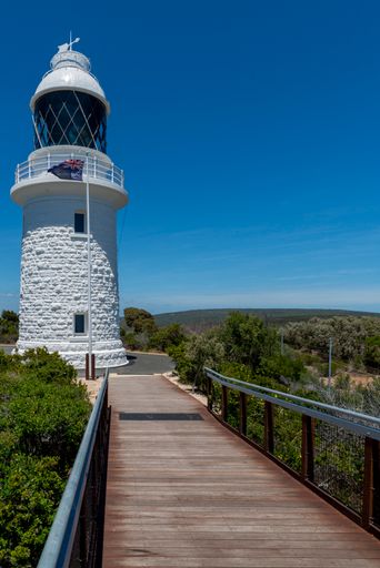 A vertical shot of the Cape Naturaliste Lighthouse in Australia under a blue sky