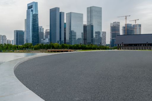 empty concrete floor in front of modern buildings in the downtown street.